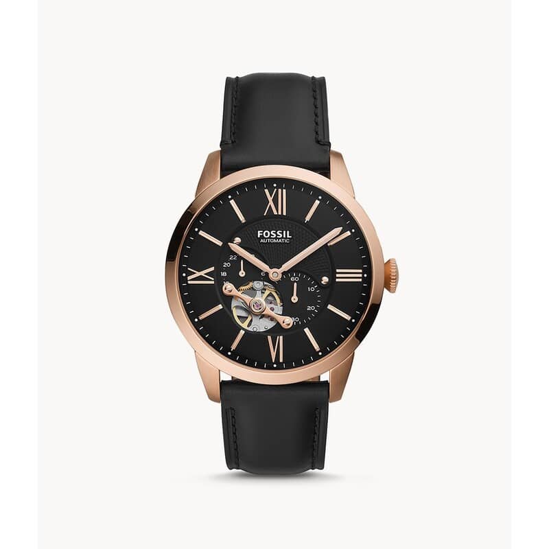 "Analog wristwatch with stainless steel case and leather strap by Fossil."